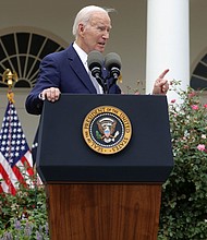 President Joe Biden speaks as  Rep. Maxwell Frost and Vice President Kamala Harris listen during a Rose Garden event on gun safety at the White House on September 22 in Washington, DC.
Mandatory Credit:	Alex Wong/Getty Images