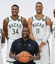 Miwaukee Bucks players Damian Lillard, Giannis Antetokounmpo, Brook Lopez, Khris Middleton and Coach Adrian Griffin pose for a photo during the NBA basketball team’s media day earlier this week.