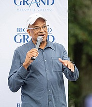 Alfred Liggins III, CEO of Urban One Inc. greets attendees during the Richmond Grand Resort and Casino Block Party on Saturday, Sept. 30, at the proposed site for the project onWalmsley Boulevard at Commerce Road in Richmond’s South Side. Urban One is one of the development partners for the casino, and Mr. Liggins discussed the positive impacts the planned casino will have on Richmond, including new jobs.