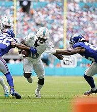 Tyreek Hill runs the ball against the New York Giants.
Mandatory Credit:	Rich Storry/Getty Images