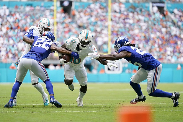 Tyreek Hill runs the ball against the New York Giants.
Mandatory Credit:	Rich Storry/Getty Images