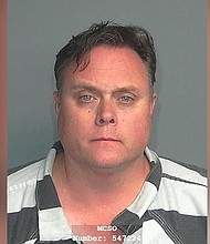 David Scott, head of Exxon Mobil's shale oil and gas business, is seen in a police mug shot obtained by Reuters on October 8.
Mandatory Credit:	Montgomery County Sheriff's Office/Handout/Reuters