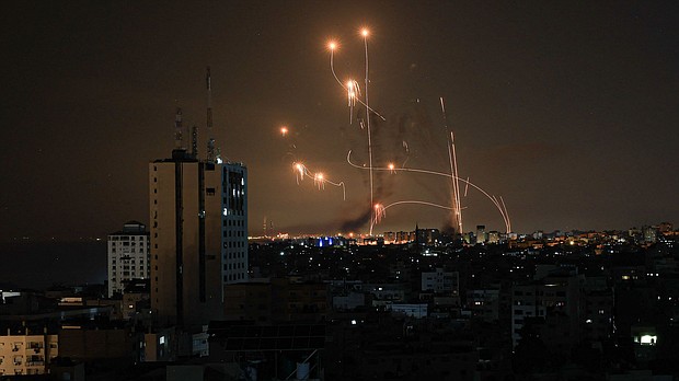 The Iron Dome defense missile system attempts to intercept rockets fired from the Gaza Strip over the city of Netivot in southern Israel on October 8.
Mandatory Credit:	Mahmud Hams/AFP via Getty Images