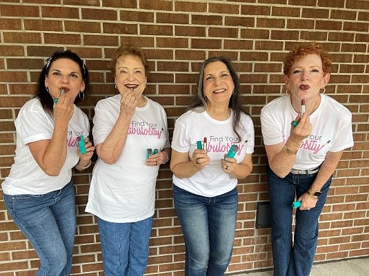 Above: Find Your Fabulosity Founder Sheryl Kurland (second from right), along with FYF volunteers, wearing Thrive Causemetics’ “Sheryl” Lipstick