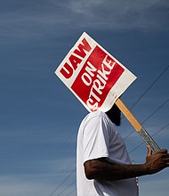 A "UAW On Strike" sign held on a picket line outside the General Motors Ypsilanti Processing Center in Ypsilanti, Michigan, on Friday, September 22.
Mandatory Credit:	Emily Elconin/Bloomberg/Getty Images