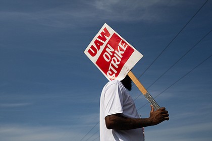 A "UAW On Strike" sign held on a picket line outside the General Motors Ypsilanti Processing Center in Ypsilanti, Michigan, on Friday, September 22.
Mandatory Credit:	Emily Elconin/Bloomberg/Getty Images