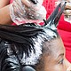 The US Food and Drug Administration is proposing to ban certain hair-straightening products, such as chemical relaxers and pressing products, that have been linked to health risks.
Mandatory Credit:	Adobe Stock