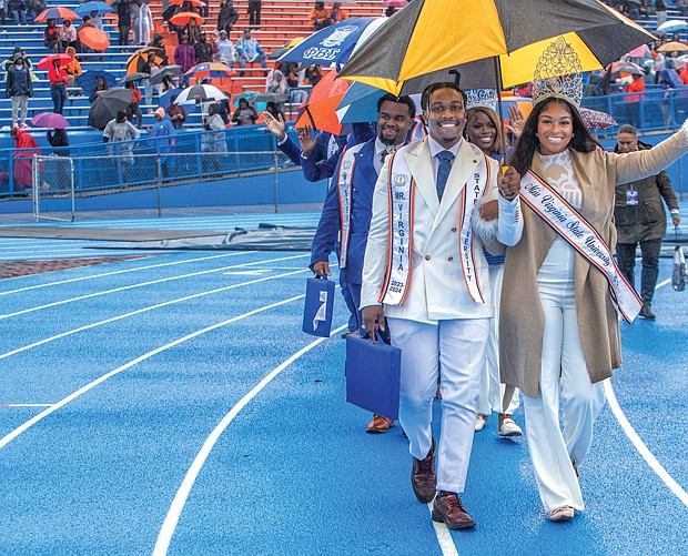 Mr. Virginia State University, Christopher Lawrence, and Miss Virginia State University, Aliya Mayers, wave to the crowd during the game, which drew 3,409 people. VSU won 39-23 over Bluefield State, leaving the Trojans 7-0 overall and atop the CIAA North with a 5-0 record.