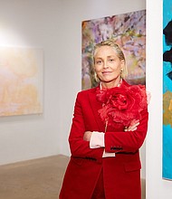 Sharon Stone with her paintings at the East Coast premiere of her art exhibition.
