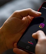 The logo of the Instagram app is seen on the screen of a smartphone in 2021.
Mandatory Credit:	Fabian Sommer/picture alliance/dpa/Getty Images