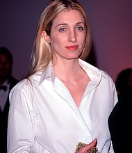 Crisp white shirts were another of her fashion mainstays.
Mandatory Credit:	Evan Agostini/Getty Images