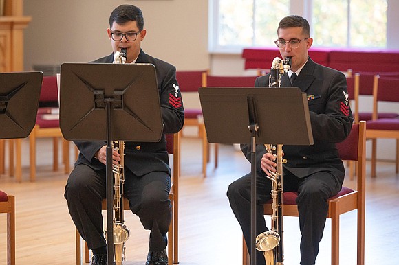 Musician 1st Class Christopher Rueda, from Mason, Ohio, and Musician 1st Class Chanse Morris, from Houston, Texas, perform with the …