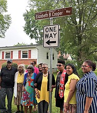 Jane Cooper Johnson, fourth from right, is surrounded by family members last June when an honorary street sign was erected in Richmond’s Westwood community to honor her mother, Bettie Elizabeth Boyers Cooper.