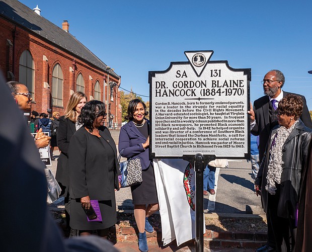 Several members and friends of Moore Street Missionary Baptist Church at 1408 W. Leigh St. attend the Nov. 11 unveiling of the Gordon Blaine Hancock Commonwealth of Virginia Historical Highway Marker at
the church. Dr. Hancock, co-founder of the Richmond Chapter of the Urban League, became the pastor of Moore Street in 1925. The same year he invented the term “Double Duty Dollar,” which meant that Black people should patronize Black-owned businesses to help build employment and instill a sense of independence in their communities.