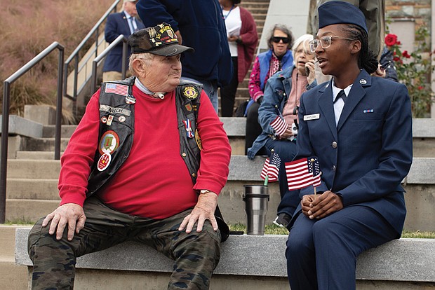 Airman Basic Ke’Mya Whitlock, right, chats with U.S. Army Vietnam War veteran Jerry Welch before the Veterans Day Ceremony. Members of the U.S. Marine Corps stationed at Ft. Gregg-Adams, home of the Combined Arms Support Command, participate in the Veterans Day Ceremony.