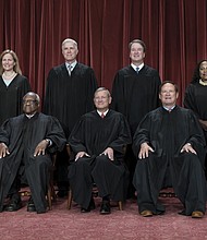 Members of the Supreme Court sit for a new group portrait in October 2022 following the addition of Justice Ketanji Brown Jackson at the Supreme Court building.