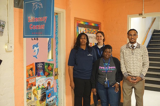 From left: Margaret Banks, a reading coach, Maria Bayliss, an early interventionist assistant, Twanya Jones, a reading interventionist, and Theron Sampson, Swansboro Elementary School principal.