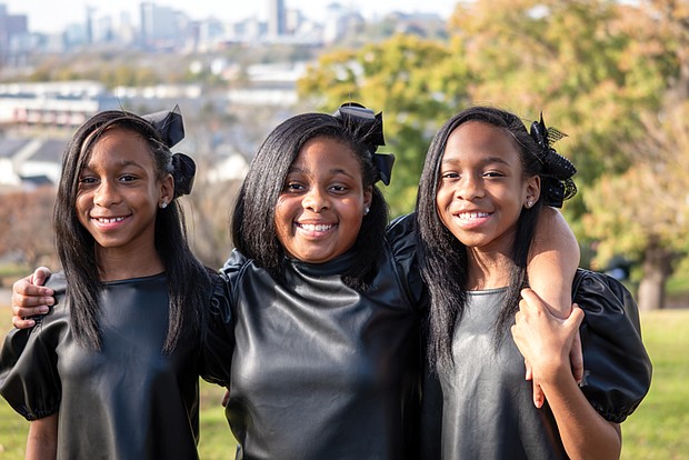 Triplets Kali’Co, Koh’Co and Keri’Co Robinson, who turned 10 on Oct. 21, are in the fourth grade at Montrose Elementary School in Henrico County.