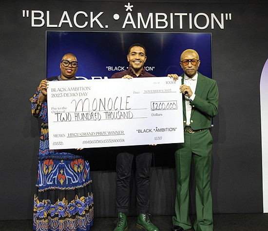 Richmond native Leslie Winston III and his company, Monocle, was the HBCU Grand Prize Winner at the 3rd Annual Black Ambition Demo Day on Nov. 9 in New York.
He accepts his prize from entrepreneur, musician and philanthropist Pharrell Williams, whose Black Ambition nonprofit initiative was founded in 2020, and Felecia Hatcher, CEO of Black Ambition.