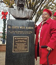 Dr. Joanne Harris Lucas proudly stands beside a bust of her late father and Virginia civil rights leader, the Rev. Curtis W. Harris Sr., which was unveiled Saturday in front of Hopewell City Hall, where he served for 26 years on the city council and for two years as the city’s first Black mayor. The unveiling comes six years after his death in December 2017. He was arrested 13 times in leading protests against segregation in Hopewell and other parts of the state and led the Hopewell Branch NAACP and the Virginia Chapter of the Southern Christian Leadership Conference for more than 20 years. During his 46 years as pastor of Union Baptist Church in Hopewell and during his tenure on council, he fought for environmental justice and opposed Hopewell commercial developments that impacted Black and poor people in the city.