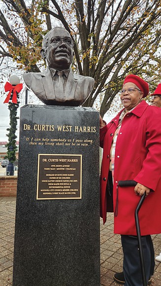 Dr. Joanne Harris Lucas proudly stands beside a bust of her late father and Virginia civil rights leader, the Rev. Curtis W. Harris Sr., which was unveiled Saturday in front of Hopewell City Hall, where he served for 26 years on the city council and for two years as the city’s first Black mayor. The unveiling comes six years after his death in December 2017. He was arrested 13 times in leading protests against segregation in Hopewell and other parts of the state and led the Hopewell Branch NAACP and the Virginia Chapter of the Southern Christian Leadership Conference for more than 20 years. During his 46 years as pastor of Union Baptist Church in Hopewell and during his tenure on council, he fought for environmental justice and opposed Hopewell commercial developments that impacted Black and poor people in the city.