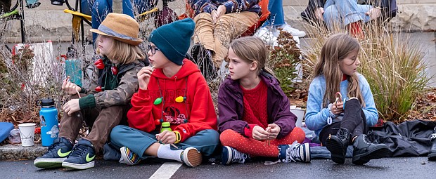 Children enjoy a front row seat at the parade.