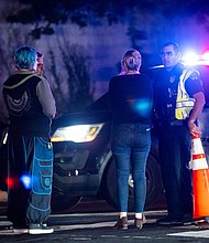 Neighborhood residents speak to police officers in Austin, Texas, on Tuesday.
Mandatory Credit:	Sara Diggins/AP