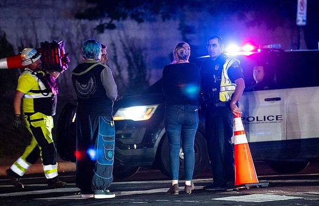 Neighborhood residents speak to police officers in Austin, Texas, on Tuesday.
Mandatory Credit:	Sara Diggins/AP