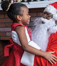 All smiles-Kinsley Hurte, 5, is excited to meet Soul Santa and give him her holiday wish list at the Black History Museum & Cultural Center of Virginia on Dec. 2.
Sandra Sellars/Richmond Free Press