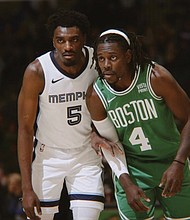Former VCU Ram Vince Williams guards the Celtics’ Jrue Holiday in a recent NBA game.