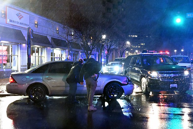 Members of the US Secret Service rush to a car after it hit a motorcade SUV as President Joe Biden was leaving his campaign headquarters in Wilmington, Delaware, on December 17.
Mandatory Credit:	Andrew Caballero-Reynolds/AFP/Getty Images