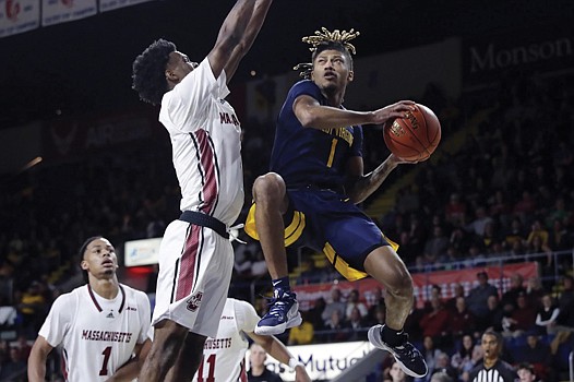 West Virginia University guard Noah Farrakhan, right, is safe to play the remainder of the season without the fear of losing eligibility. West Virginia Attorney General Patrick Morrisey announced on Monday afternoon that the judge has signed the order that saves the now-eligible players from burning their eligibility during the temporary restraining order against the NCAA.