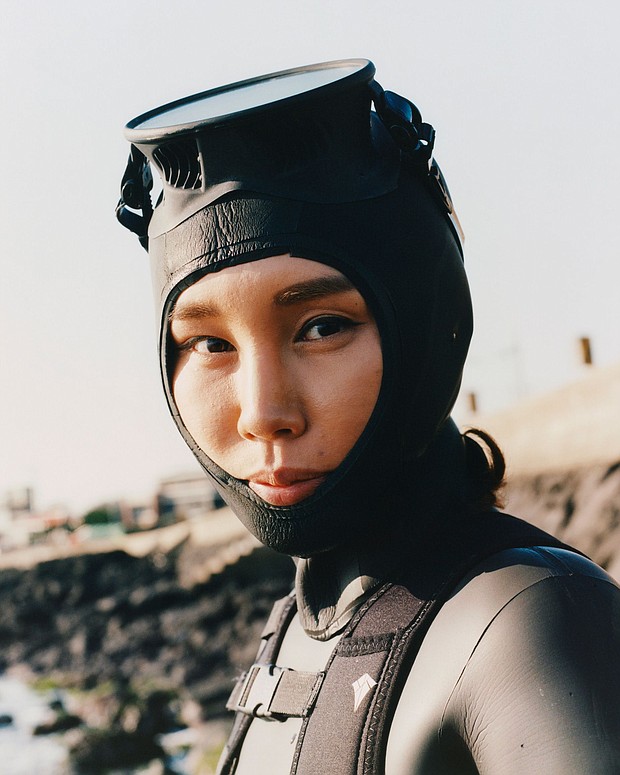 The Haenyeo community’s remarkable traditions have endured throughout generations, specifically their skill in diving without equipment such as oxygen tanks.
Mandatory Credit:	Peter Ash Lee