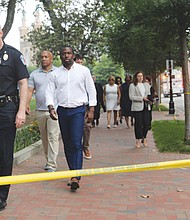 Acting Police Chief Rick Edwards walks with Richmond Mayor Levar Stoney and other city officials to brief news media following a shooting that left two people dead outside of the Altria Theater. The shooting occurred after Huguenot High School’s graduation on June 6.