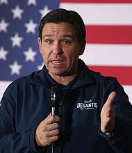 Florida Gov. Ron DeSantis speaks to guests during a campaign rally on December 2, in Newton, Iowa.
Mandatory Credit:	Scott Olson/Getty Images