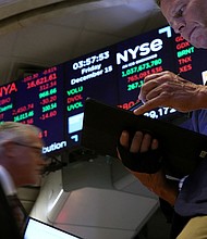 Traders work on the floor at the New York Stock Exchange in New York City, December 15.
Mandatory Credit:	Brendan McDermid/Reuters