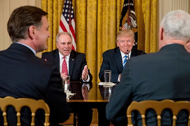 In this 2017 photo, President Donald Trump listens as Rep. Steve Scalise speaks in the East Room of the White House in Washington, DC.
Mandatory Credit:	Andrew Harnik/AP/File