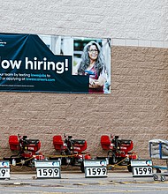 A "Now Hiring" sign at a Lowe's store in Glenmont, New York, on Tuesday, Nov. 14.
Mandatory Credit:	Angus Mordant/Bloomberg/Getty Images