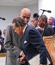 Rev. A. Lincoln James Jr. talks with Dr. Lester Frye during the Emancipation Day Service at Sharon Baptist Church. Dr. Frye is president of the Baptist Ministers’ Conference of Richmond and Vicinity, which sponsors the annual event.