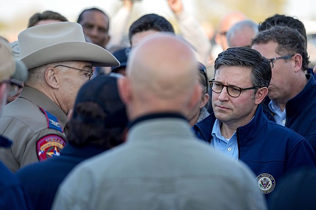 House Speaker Mike Johnson, right, is briefed by Texas Department of Public Safety chief Steve McCraw, left, on January 3 in Eagle Pass, Texas.
Mandatory Credit:	Eric Gay/AP