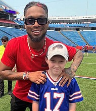 David Lyons (right) met Buffalo Bills safety Damar Hamlin at a CPR training event held by the team and the American Heart Association. (Photo courtesy of Russ Lyons)