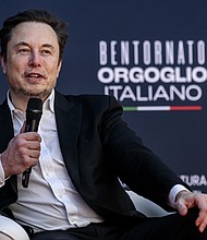 Tesla CEO Elon Musk is pictured here speaking in Italy in December. Short sellers lost more money betting against Tesla than any other company last year.
Mandatory Credit:	Antonio Masiello/Getty Images