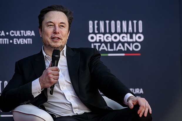 Tesla CEO Elon Musk is pictured here speaking in Italy in December. Short sellers lost more money betting against Tesla than any other company last year.
Mandatory Credit:	Antonio Masiello/Getty Images