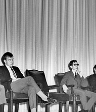 The people pictured behind Dr. King are (left to right): Bernard Lee, special assistant to Dr. King; Charles Cox, the chair of the Students' Association Academic Committee (now called the Student Senate); Bert Moore, vice president of the SMU Students' Association; and Sanford Coon, Perkins School of Theology student.