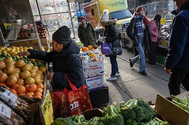 Patrons shop for produce at a Mr. Pina Market in Brooklyn, New York, on December 26. The US inflation picture greatly improved in 2023, and so have Americans’ attitudes about it.
Mandatory Credit:	Victor J. Blue/Bloomberg/Getty Images