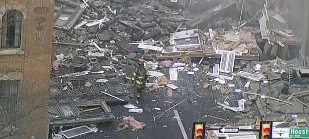 Twenty-one people were injured as a result of a gas explosion at a historic downtown Fort Worth hotel, covering the streets in debris.
Mandatory Credit:	KTVT
