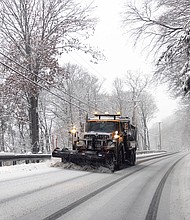 A snow plow operates during a storm in Hudson, New York, US, on Sunday, Jan. 7. Hundreds of flights have been grounded across the US from a pair of winter storms that left more than a foot of snow in New York's Hudson Valley and sparked blizzard warnings across the Great Plains.
Mandatory Credit:	Angus Mordant/Bloomberg/Getty Images