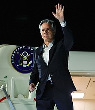 US Secretary of State Antony Blinken waves as he departs from al-Ula in northwestern Saudi Arabia for Tel Aviv on January 8 during his week-long trip aimed at calming tensions across the Middle East.
Mandatory Credit:	Evelyn Hockstein/Pool/Getty Images