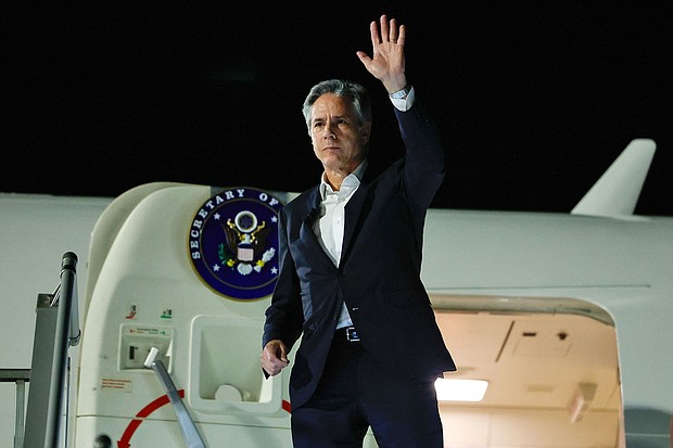 US Secretary of State Antony Blinken waves as he departs from al-Ula in northwestern Saudi Arabia for Tel Aviv on January 8 during his week-long trip aimed at calming tensions across the Middle East.
Mandatory Credit:	Evelyn Hockstein/Pool/Getty Images