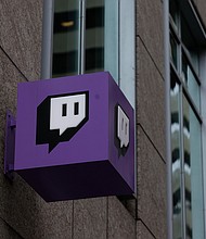 Twitch, an Amazon owned company, signage outside its headquarters, Tuesday, Dec. 26, 2023, in San Francisco. Video game streaming company Twitch said January 10 it is laying off 500 workers as part of ongoing cost-cutting efforts.
Mandatory Credit:	Aaron M. Sprecher/AP